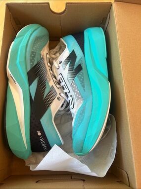 New Balance Men's Rebel Running Shoes in Teal and Black